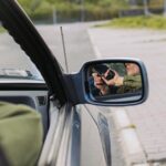 Person in Green Jacket Driving Car